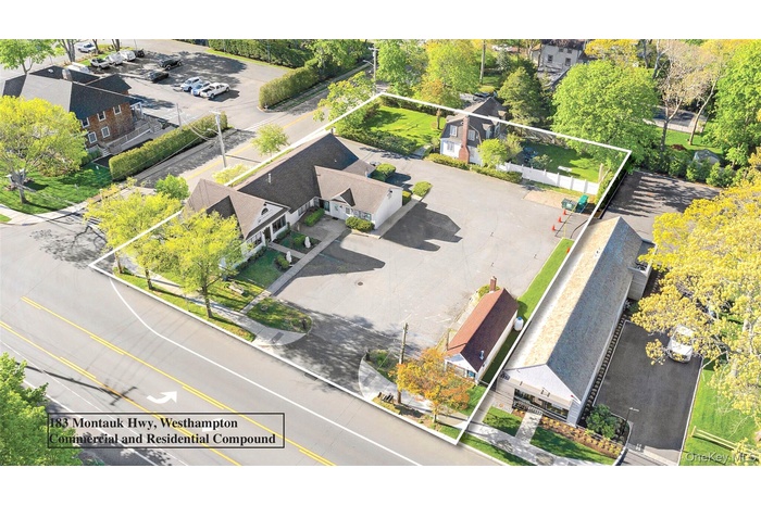 Aerial view of residential area with property parcel outlined