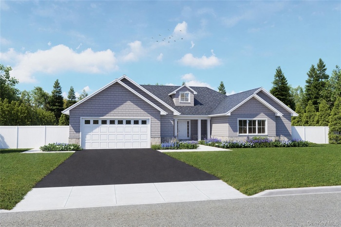 View of front facade featuring driveway, stone siding, and a garage