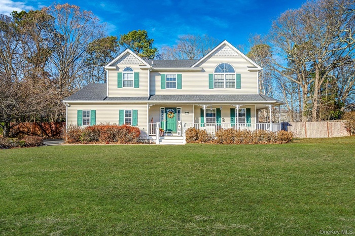 View of front of home featuring a porch and a shingled roof