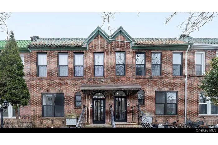 View of front of property featuring brick siding