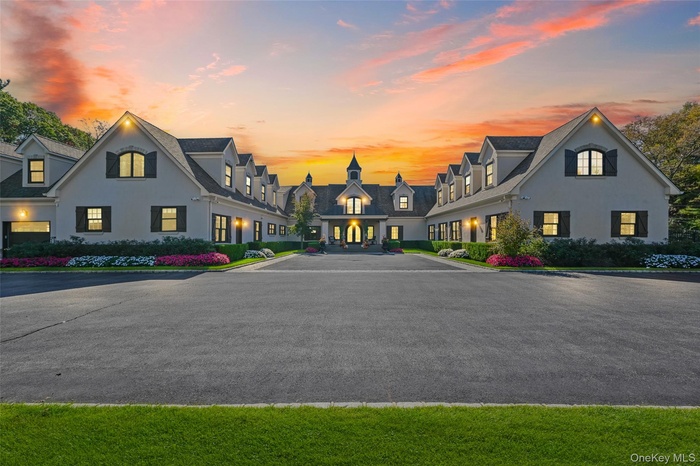 View of front facade with stucco siding and a residential view