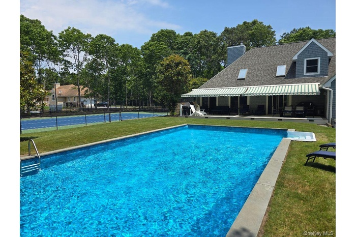Outdoor pool with a patio area