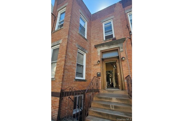 Entrance to property with brick siding