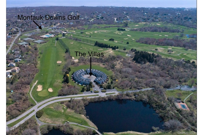 Aerial view of property's location featuring a large body of water