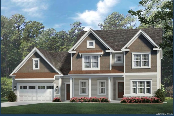 Craftsman house with a front yard, a garage, and concrete driveway