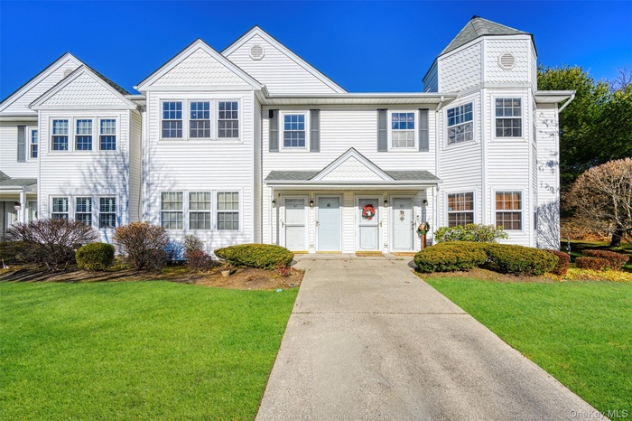 View of front of house with a front yard