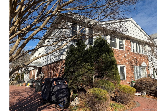 View of side of property with brick siding