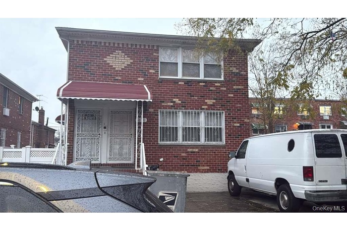 View of front facade featuring brick siding