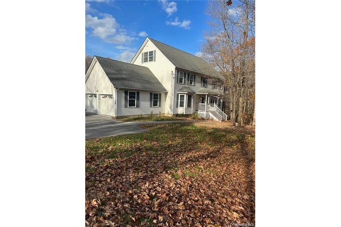 View of front of property featuring a garage