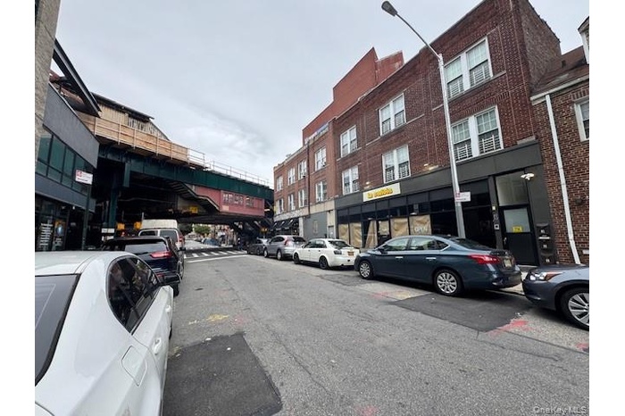 View of asphalt street with street lights