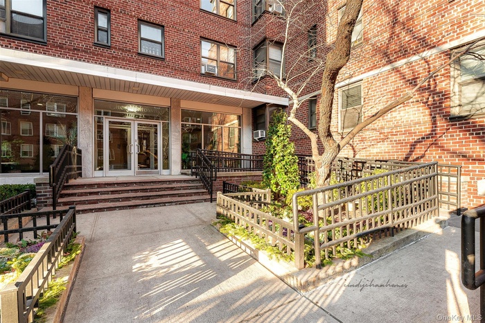 Doorway to property featuring french doors and brick siding