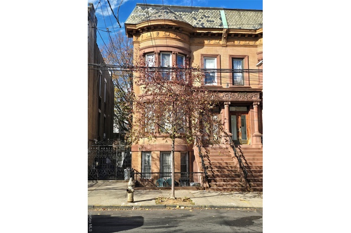 View of building exterior featuring stairway