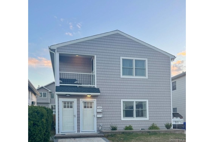 Traditional-style house with a balcony