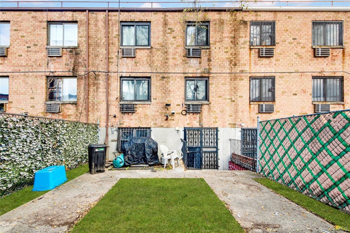 Rear view of house featuring brick siding