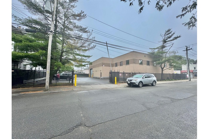 View of asphalt road with sidewalks and curbs