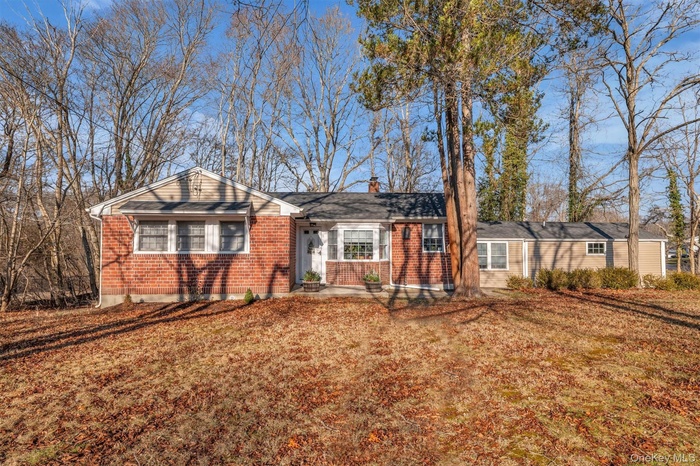 Single story home featuring brick siding/