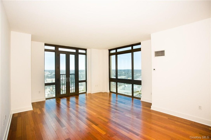 Spacious corner unit, living room with Juliette doors.