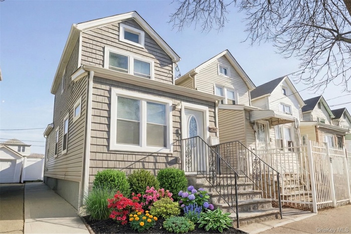 View of front of house featuring an outbuilding