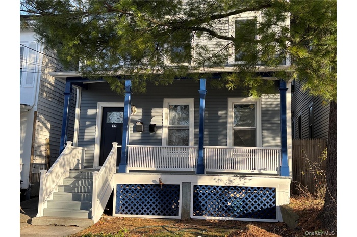 View of front of house with covered porch