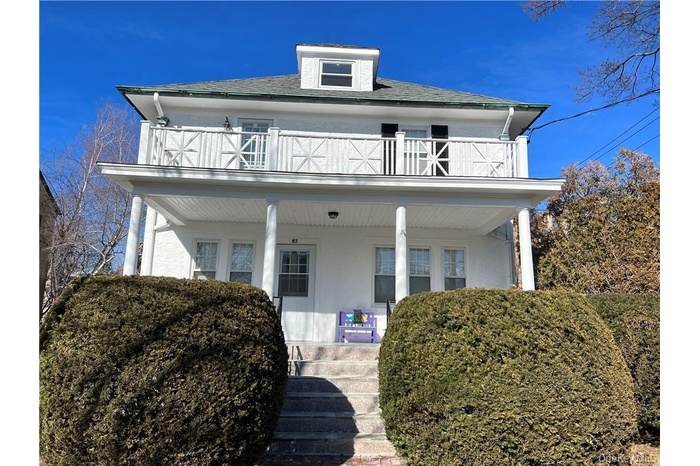 Beautiful colonial with front porch and balcony