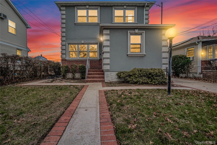 View of front of home with stucco siding