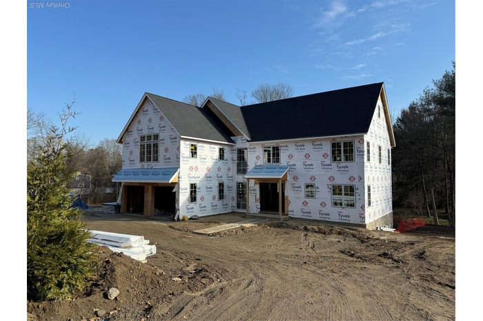 Property in mid-construction with driveway