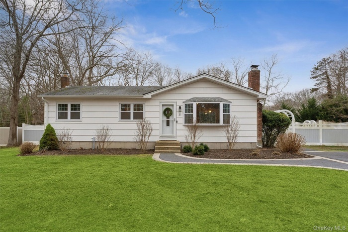 Single story home with a chimney