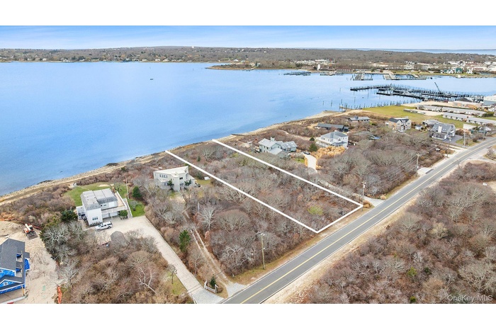 Aerial overview of property's location with a nearby body of water