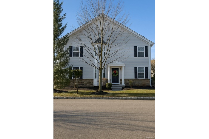 View of front facade with stone siding