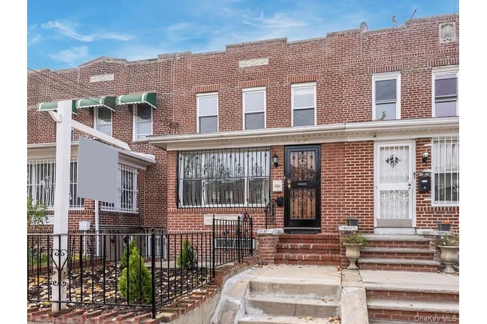 Traditional-style home featuring brick siding