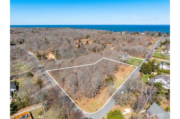 View of property location with property boundaries highlighted and a large body of water