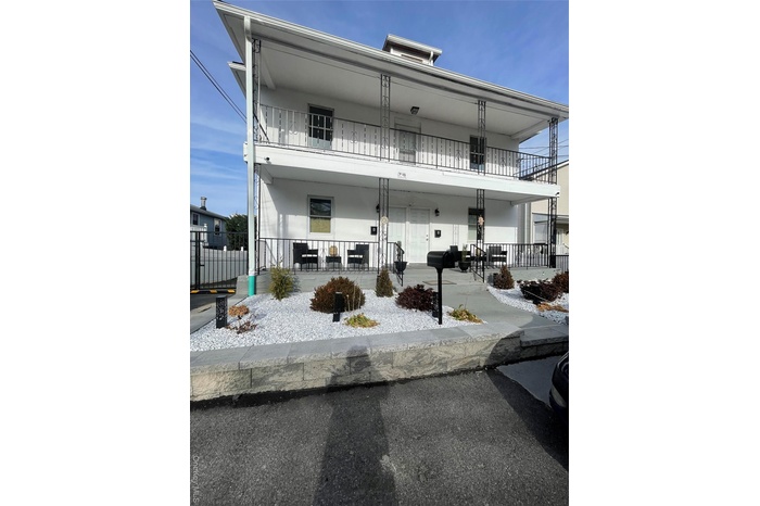 View of front of property featuring stucco siding