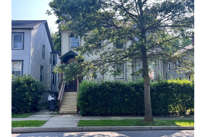 View of property hidden behind natural elements