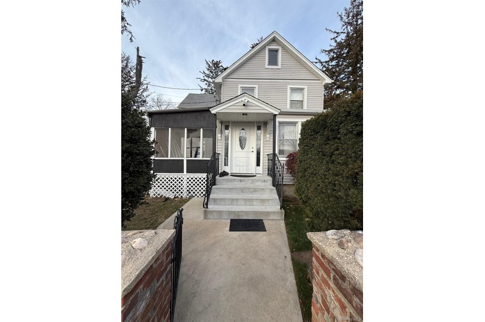 View of front facade featuring a porch
