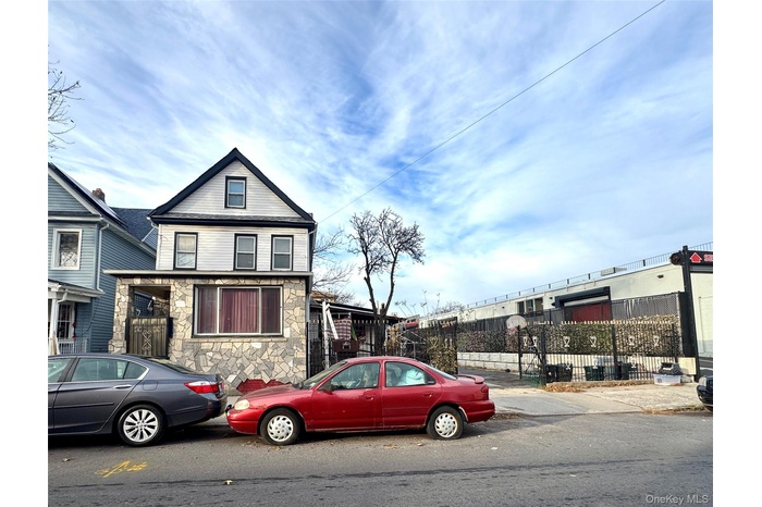 View of front facade featuring stone siding
