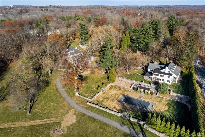 Comprehensive look at main residence, guest apartment/stable complex, stone cottage, and landscaped grounds.