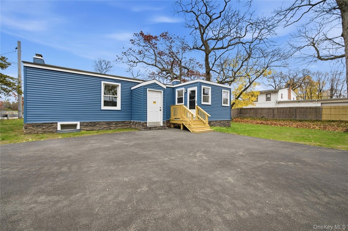 View of front facade featuring a chimney