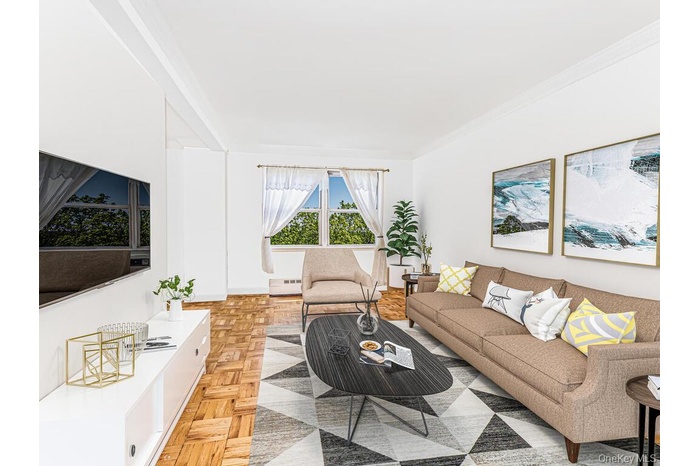 Living room featuring ornamental molding