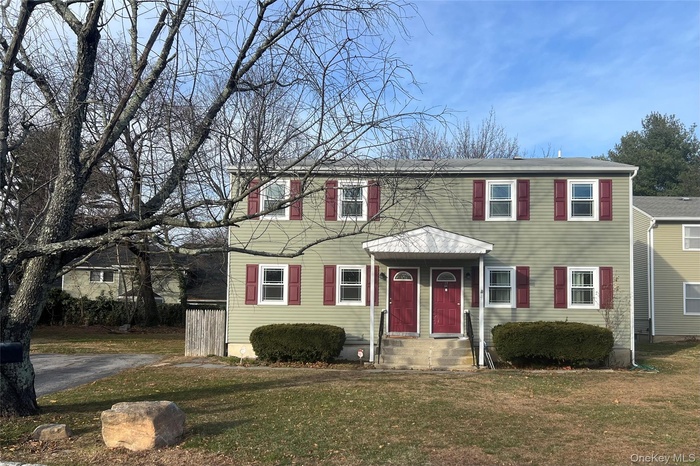 View of front of property with a front yard
