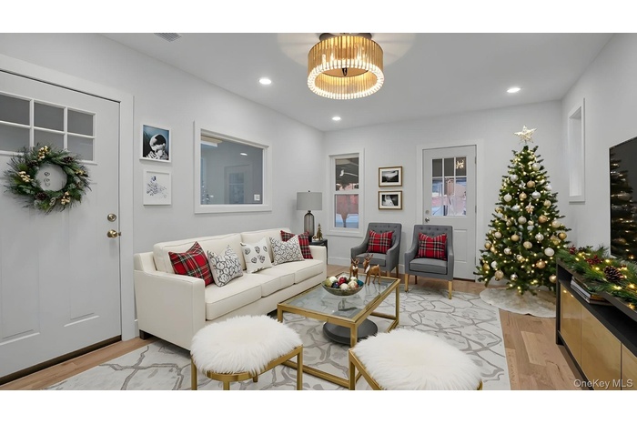 Living area featuring recessed lighting and light wood-style floors