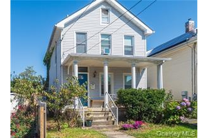 View of front of property featuring a porch
