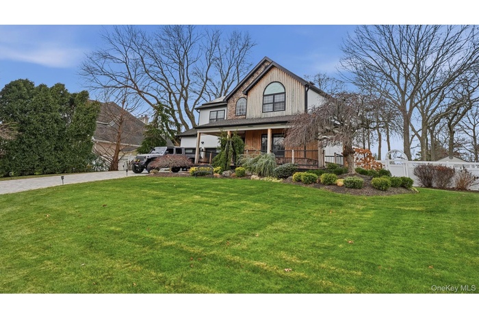 View of front of house with covered porch