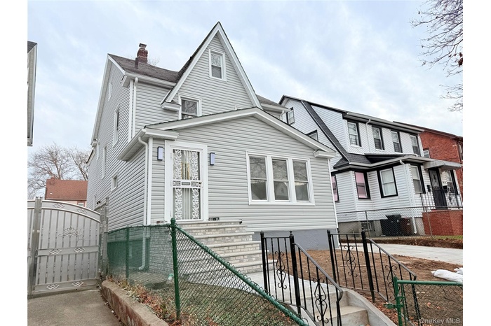 View of front facade with a gate