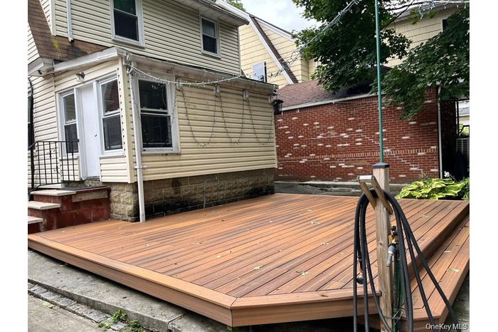 Wooden deck with a patio area