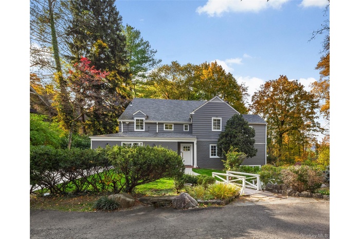 View of front of home with roof with shingles