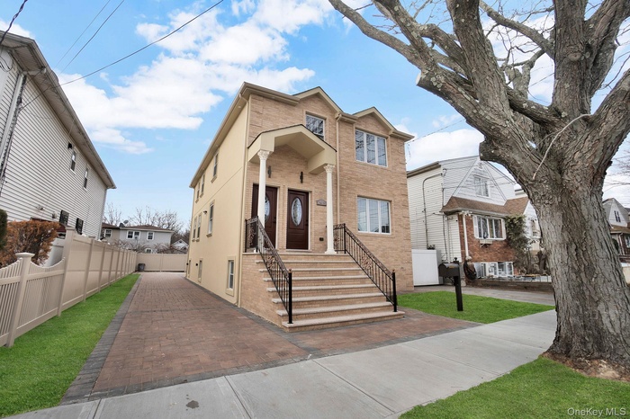 Traditional home featuring brick siding