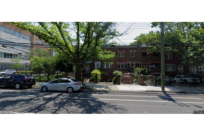 View of property featuring a fenced front yard