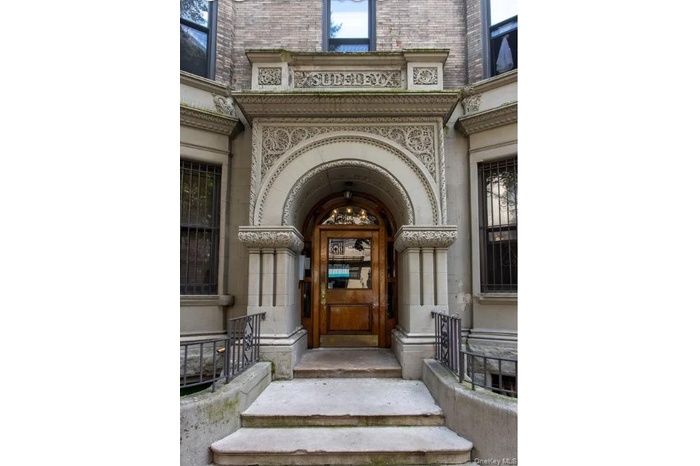 Entrance to property with brick siding
