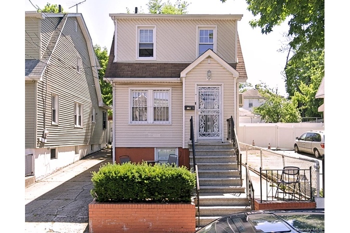 View of front of property featuring a shingled roof
