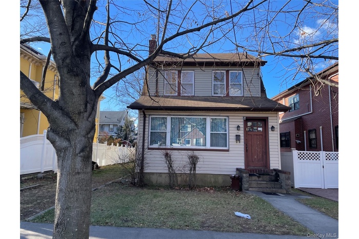 View of front of house featuring a chimney